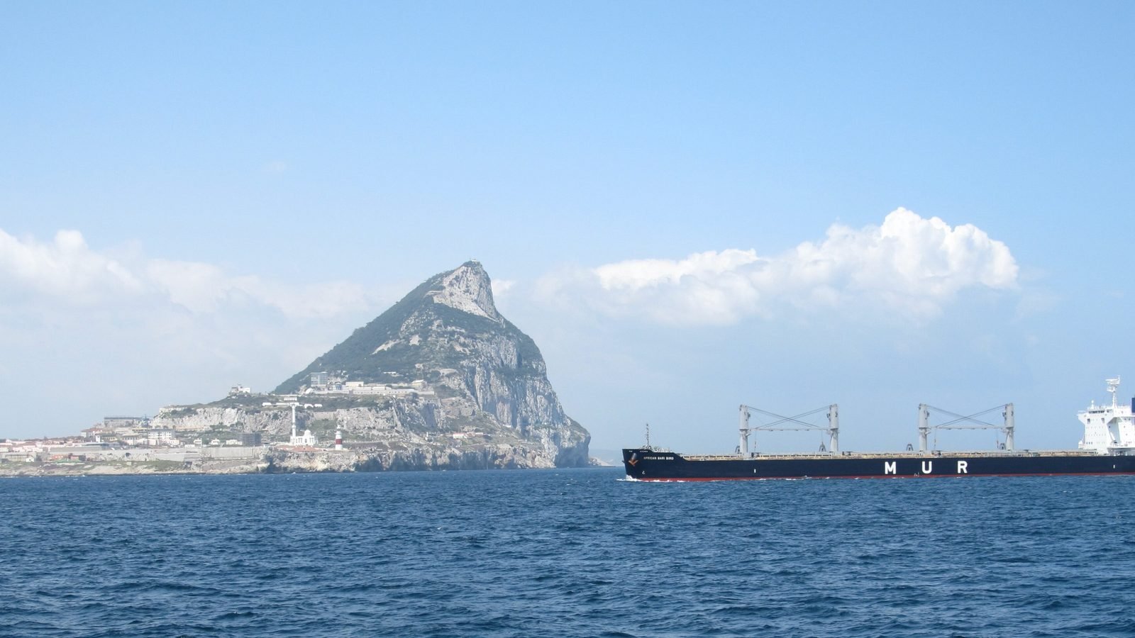 Dry-bulk carrier under way past Gibraltar, representing the Star Bulk Carriers fleet and the dry-bulk freight cycle