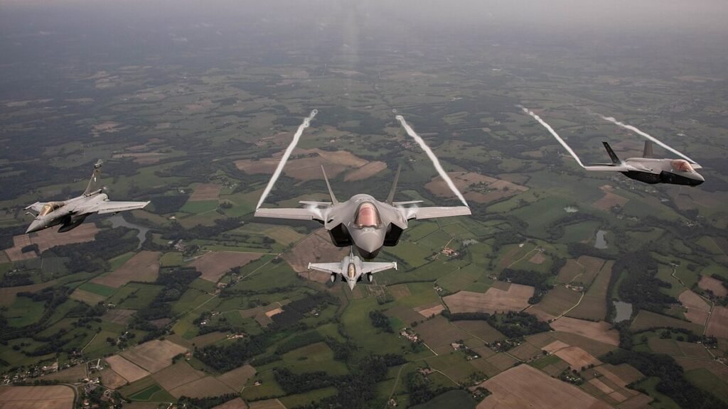 US Air Force F-35A leading two French Air Force Rafale fighters in formation